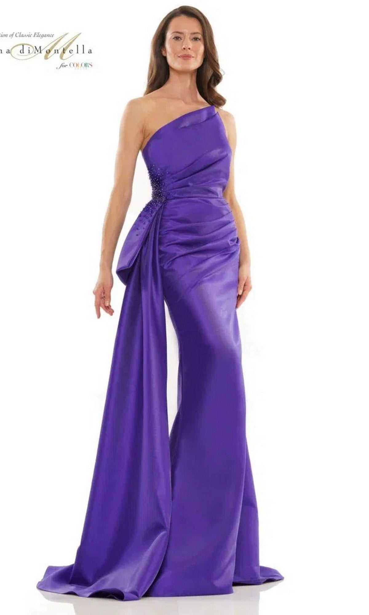 A woman stands against a plain white background wearing the Long Formal Dress: Rina Di Montella RD2750, a floor-length, one-shoulder purple gown featuring a draped side train and sheath silhouette.